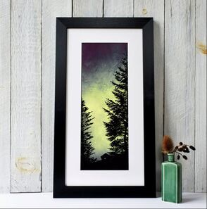 Silhouette of a wooden forest cabin nestled deep in a Pine forest. By Fiona Gray