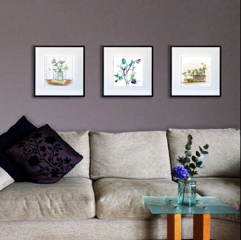 Fiona Gray Botanical watercolour effect prints displayed in a lounge setting