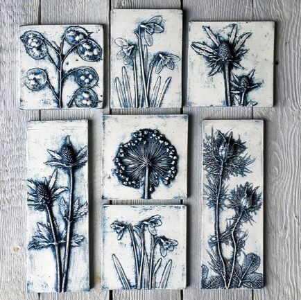 Blue coloured plaster cast flower tiles by Fiona Gray