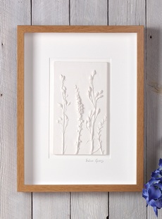 Mixed stems plaster cast tile in Oak effect frame