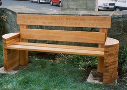 Wooden bench with carved text