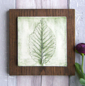 Green Beech leaf plaster cast tile on stained Ash