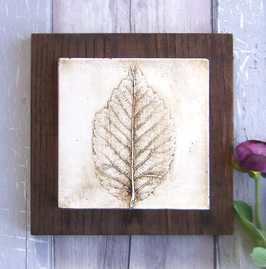 Brown Beech leaf plaster cast tile on stained Ash