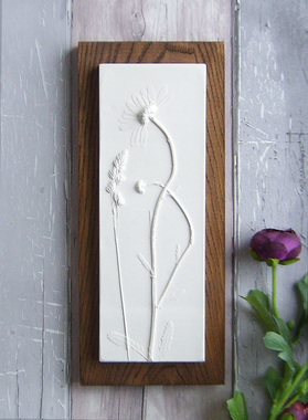 Daisy plaster cast tile on stained Ash
